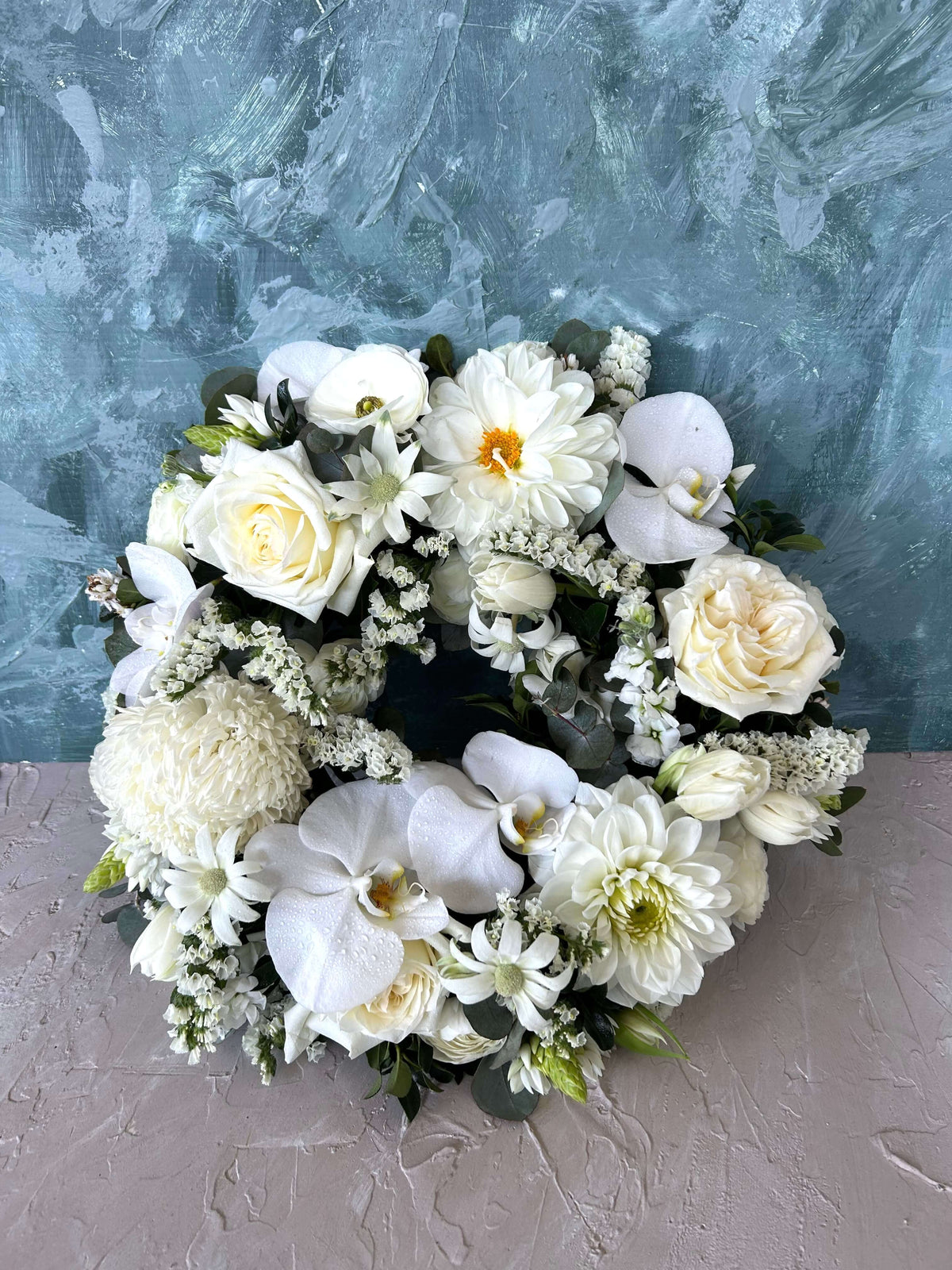 modern white funeral wreath