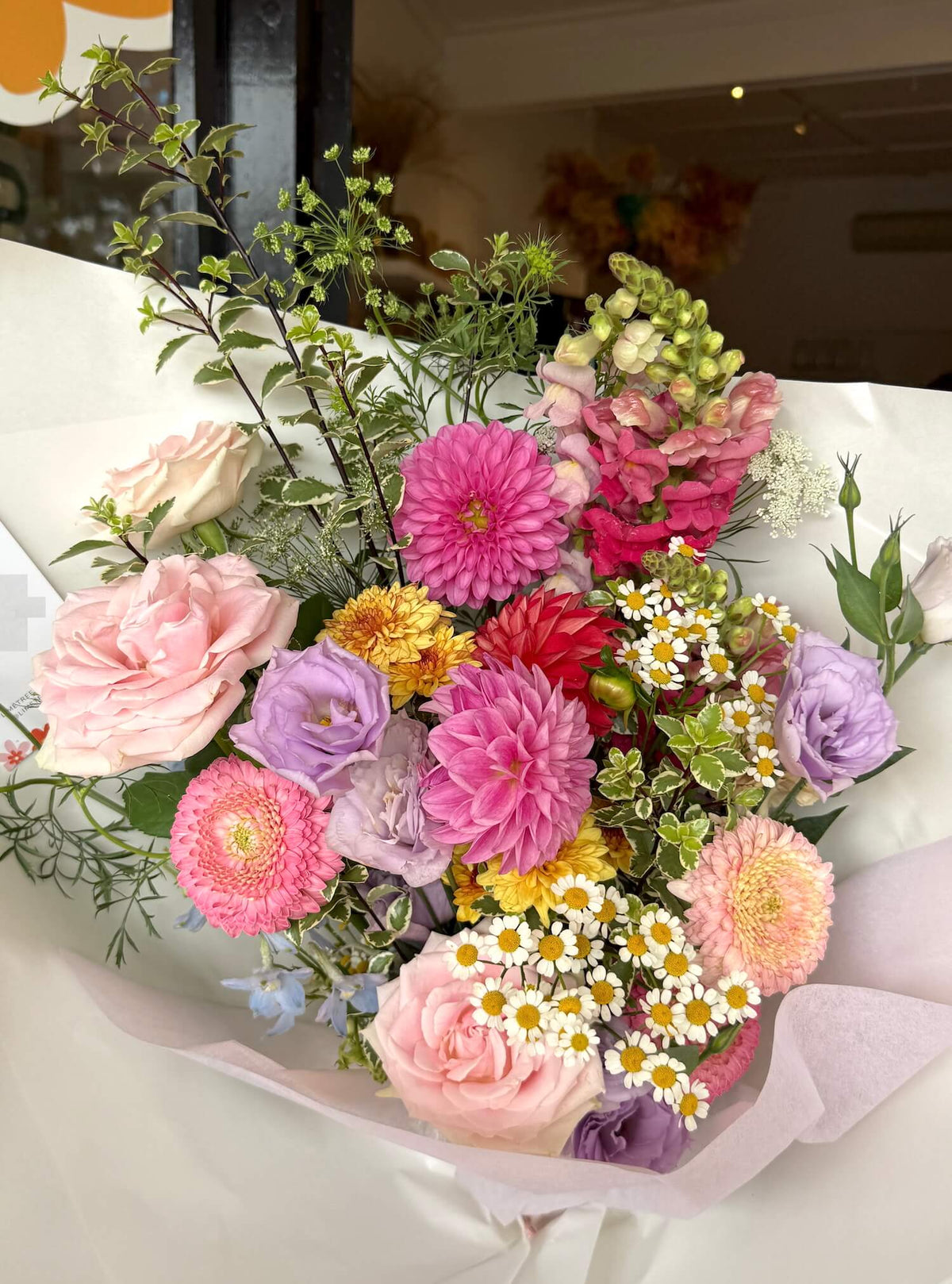 Bouquet of colorful flowers on a white surface